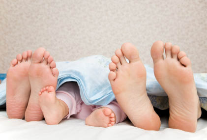 adult and baby feet